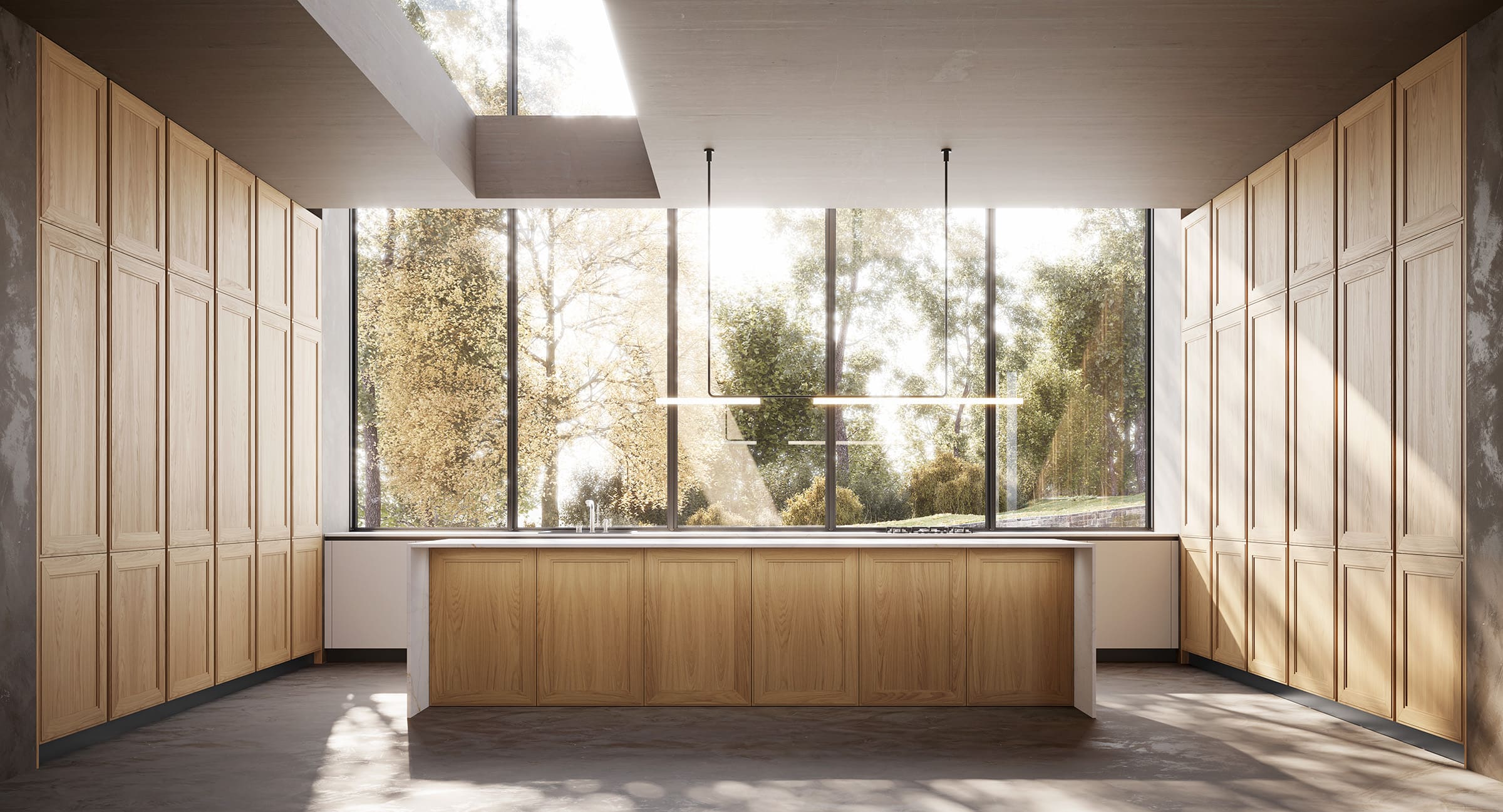 Cocina con muebles de madera clara y una gran isla central con encimera blanca.